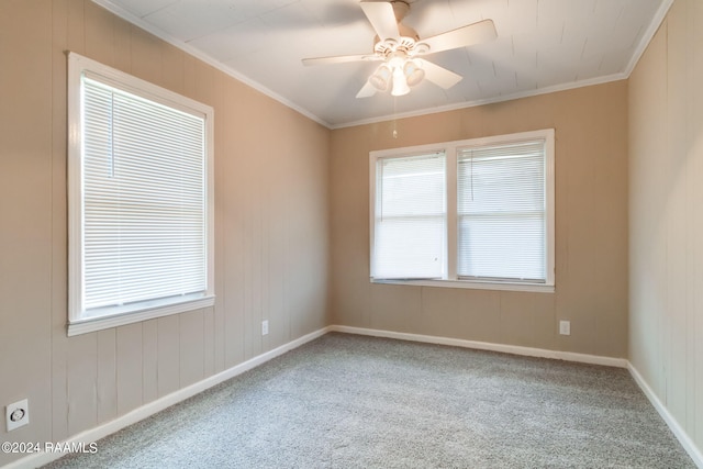 unfurnished room featuring a wealth of natural light, ceiling fan, and light carpet