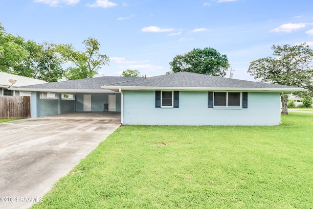 single story home with a carport and a front lawn