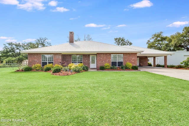 ranch-style house with a carport and a front lawn