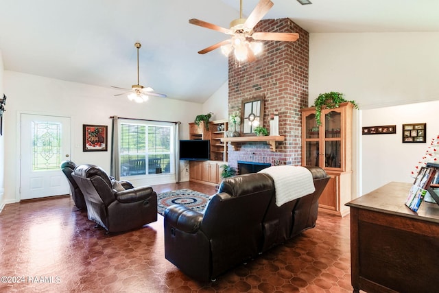 living room featuring lofted ceiling, plenty of natural light, ceiling fan, and a fireplace