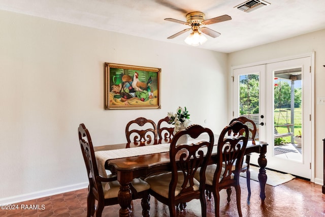 dining area with ceiling fan and french doors