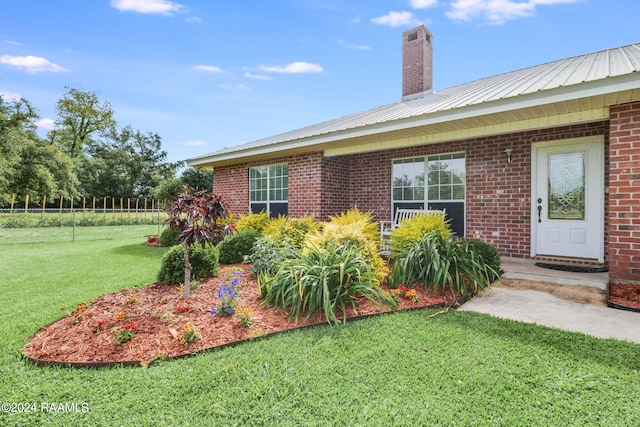 exterior space featuring a front lawn