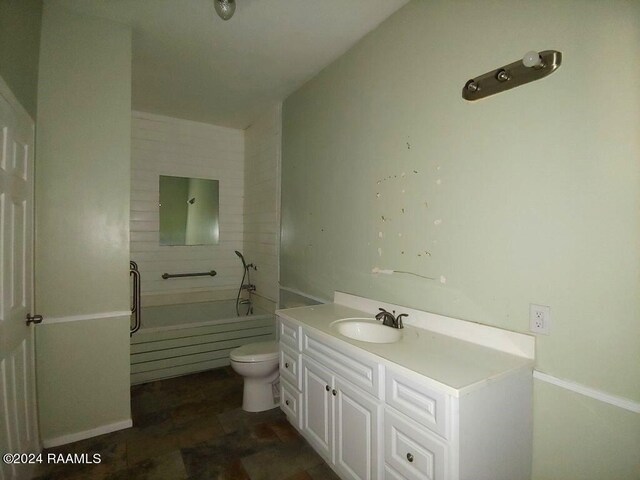 bathroom with toilet and vanity