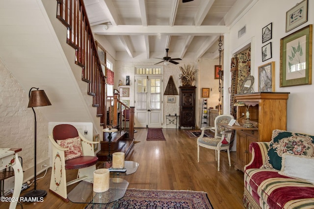 interior space featuring hardwood / wood-style flooring, beamed ceiling, and ceiling fan