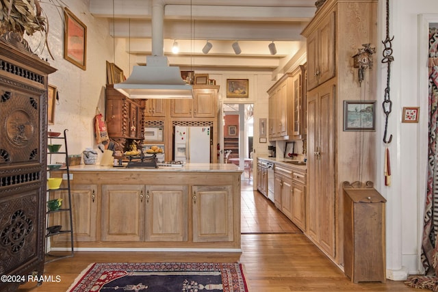 kitchen with light brown cabinets, white appliances, light wood-type flooring, beam ceiling, and pendant lighting