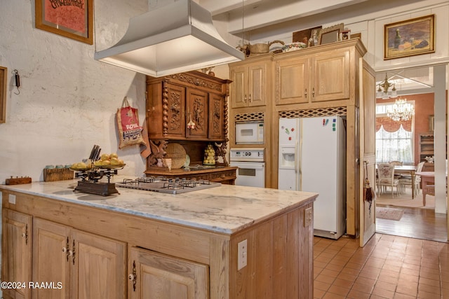 kitchen with custom exhaust hood, light tile floors, light brown cabinetry, white appliances, and an inviting chandelier