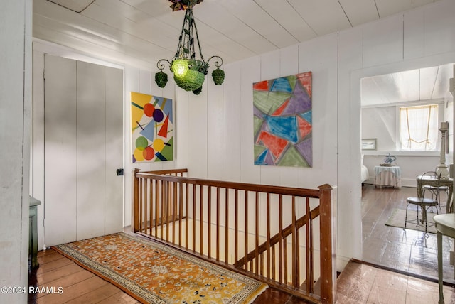 hallway with wood-type flooring