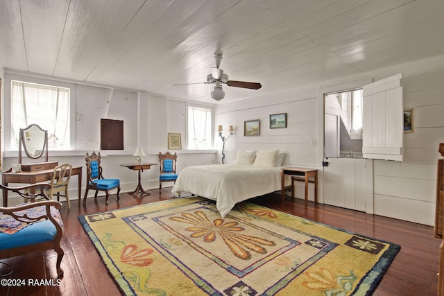 bedroom with ceiling fan and hardwood / wood-style floors