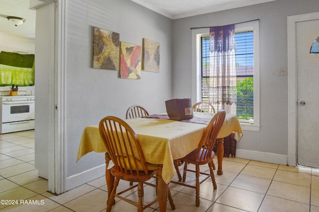 tiled dining space with a notable chandelier, crown molding, and a wealth of natural light