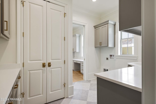 kitchen featuring gray cabinetry and ornamental molding