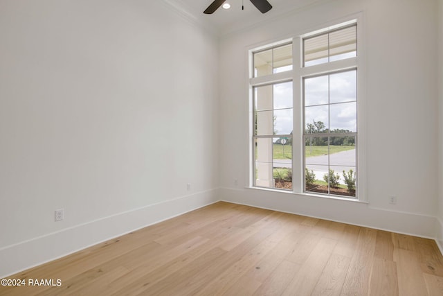 unfurnished room with light wood-type flooring, ceiling fan, and ornamental molding