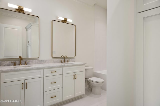 bathroom featuring toilet, vanity, and tile patterned flooring