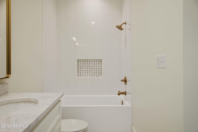 full bathroom with toilet, tiled shower / bath combo, and vanity