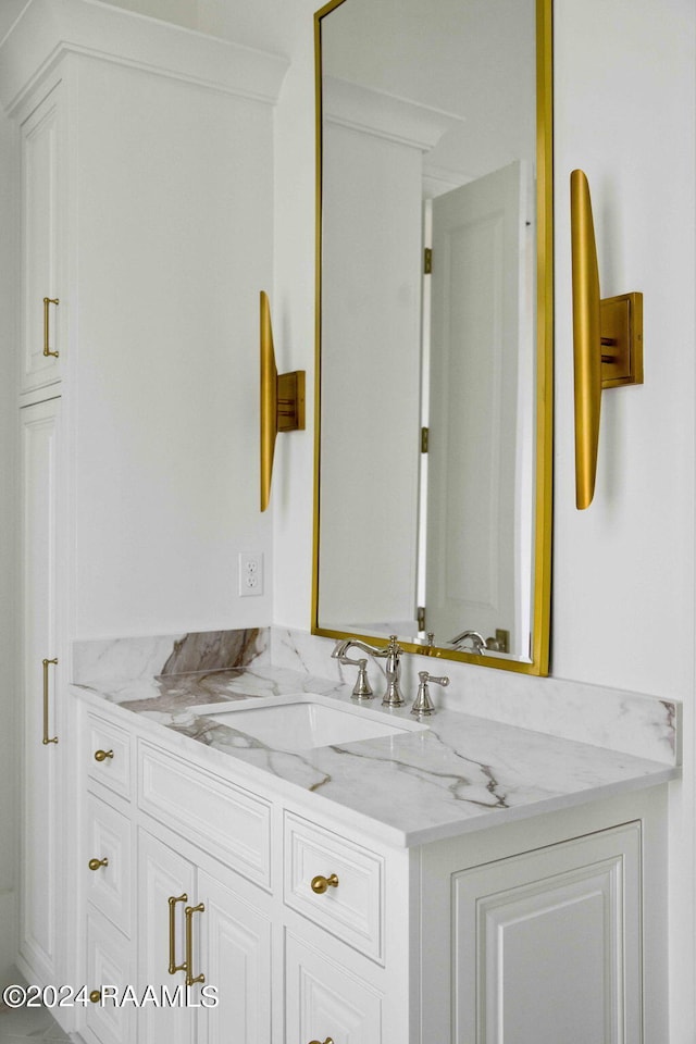 bathroom featuring vanity and crown molding