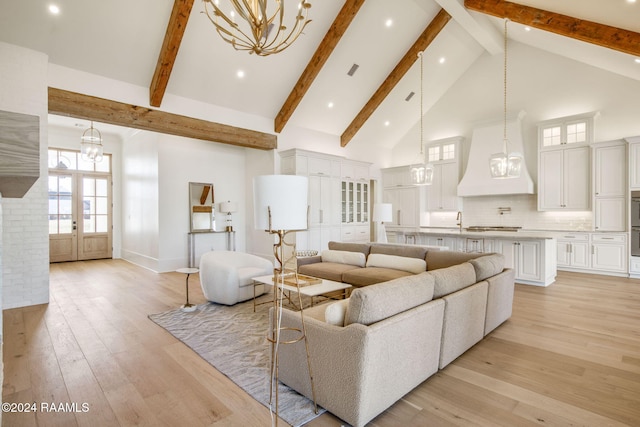 living room featuring high vaulted ceiling, light hardwood / wood-style floors, french doors, and beamed ceiling