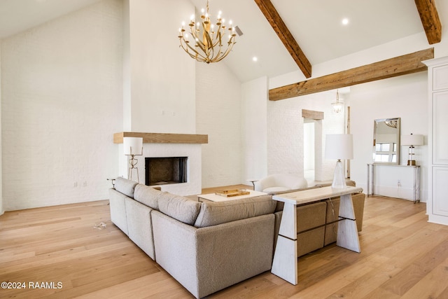 living room featuring a chandelier, light hardwood / wood-style floors, beam ceiling, and high vaulted ceiling