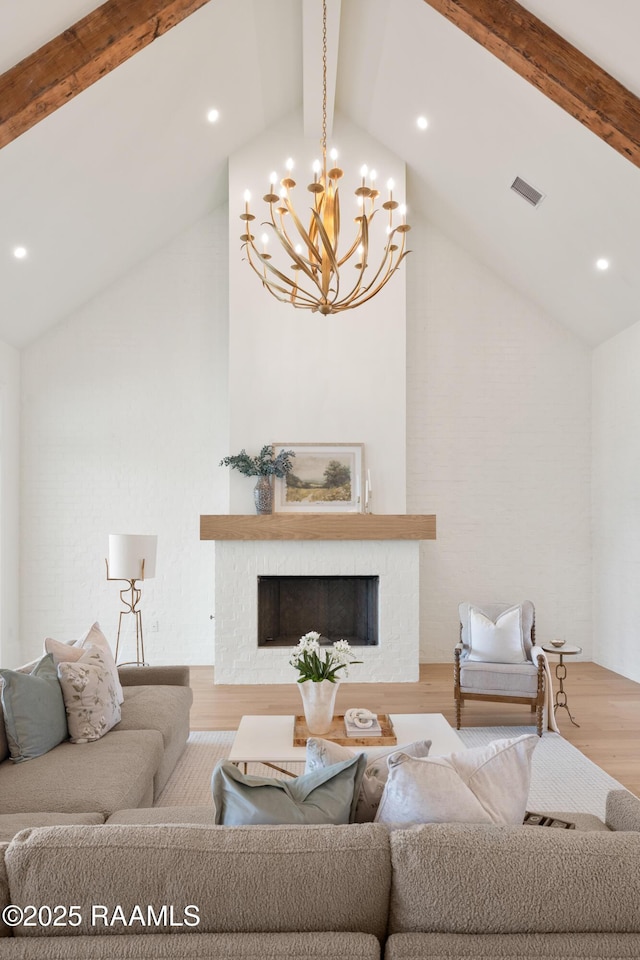 225 Gunter Grass Ct, Lafayette, LA 70508 - living room featuring a fireplace, visible vents, beam ceiling, and wood finished floors