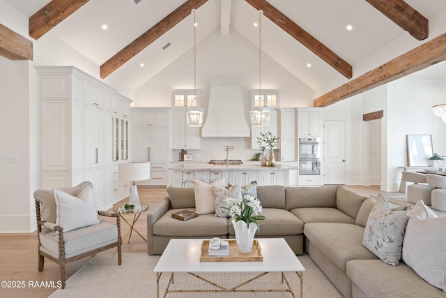225 Gunter Grass Ct, Lafayette, LA 70508 - living area with baseboards, high vaulted ceiling, light wood-style flooring, and beamed ceiling