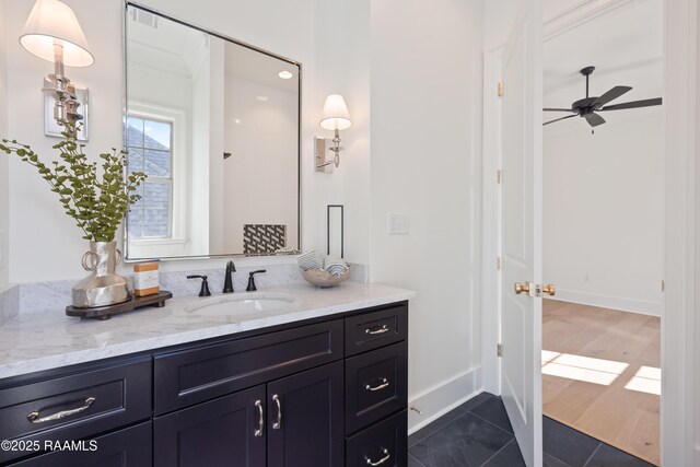 225 Gunter Grass Ct, Lafayette, LA 70508 - bathroom with a ceiling fan, vanity, tile patterned floors, and baseboards