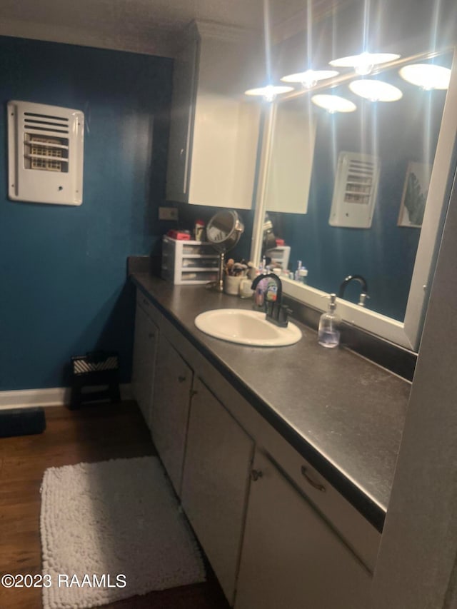 bathroom with vanity and hardwood / wood-style floors