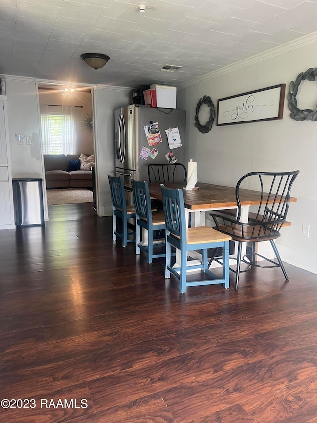 dining area featuring dark hardwood / wood-style floors