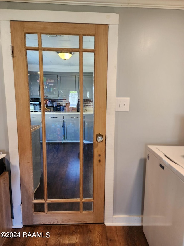 interior space featuring wood-type flooring and washer / clothes dryer