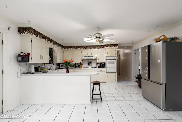 kitchen featuring stainless steel fridge, ceiling fan, and light tile floors