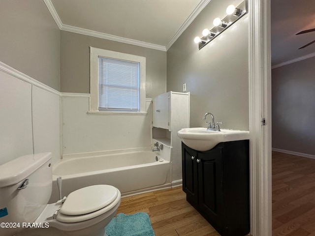 full bathroom featuring vanity, hardwood / wood-style flooring, crown molding, and toilet