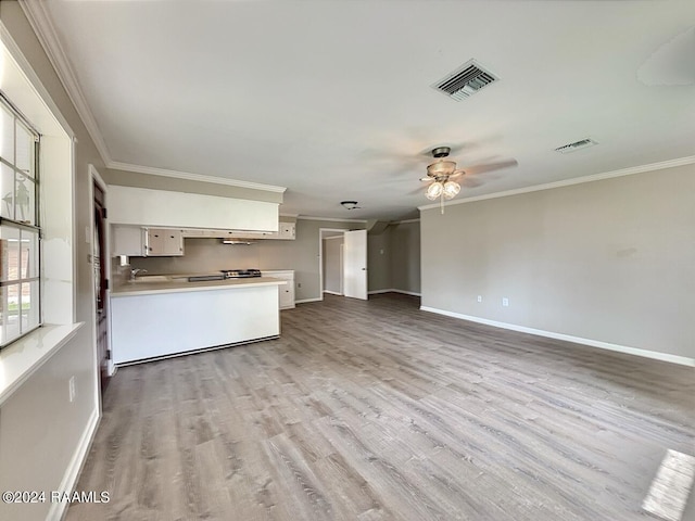 unfurnished living room with wood-type flooring, ceiling fan, and crown molding