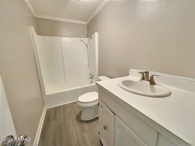 full bathroom with tub / shower combination, a textured ceiling, toilet, vanity, and hardwood / wood-style flooring