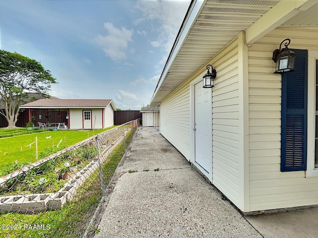 view of side of home with a yard