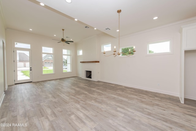 unfurnished living room featuring ceiling fan with notable chandelier, ornamental molding, and light hardwood / wood-style floors