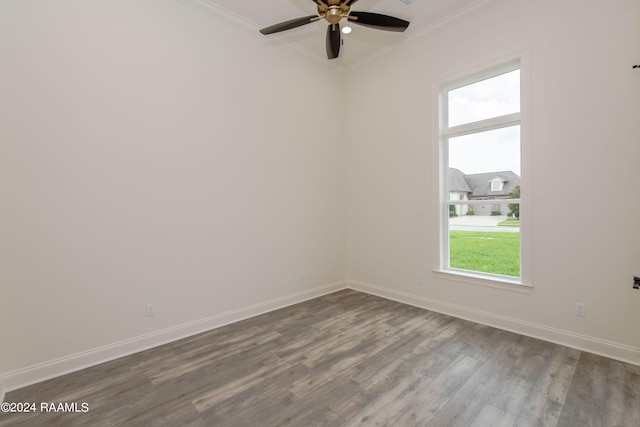 spare room featuring hardwood / wood-style floors, ceiling fan, and crown molding