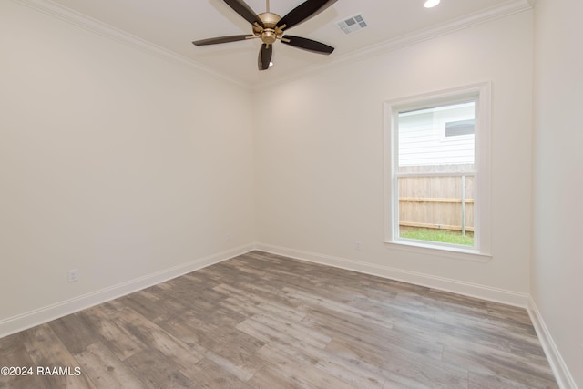 unfurnished room with ceiling fan, crown molding, and light hardwood / wood-style flooring