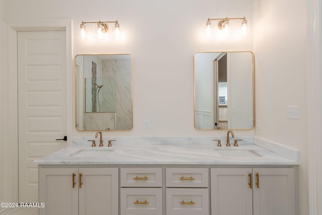 bathroom with a shower and vanity