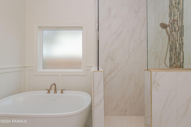 bathroom featuring sink and separate shower and tub