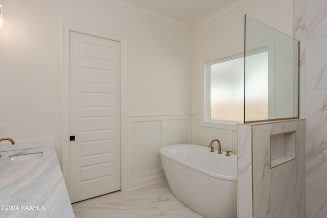 bathroom with a tub, crown molding, and vanity