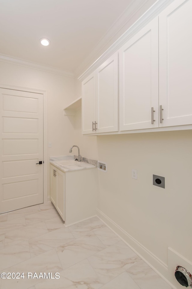 clothes washing area featuring electric dryer hookup, ornamental molding, cabinets, and washer hookup