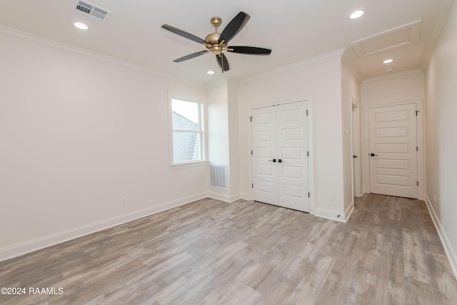 unfurnished bedroom featuring a closet, ceiling fan, light hardwood / wood-style floors, and crown molding