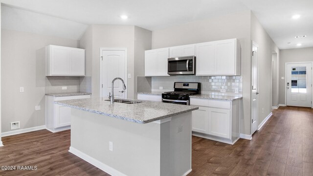 kitchen featuring a kitchen island with sink, white cabinets, sink, dark hardwood / wood-style flooring, and stainless steel appliances