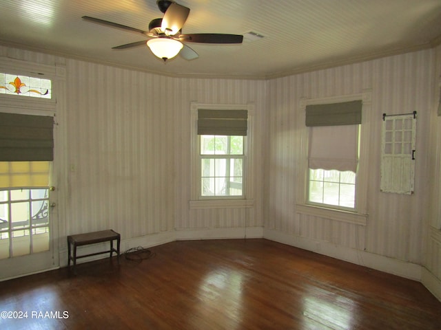 spare room with ceiling fan, crown molding, and dark hardwood / wood-style floors