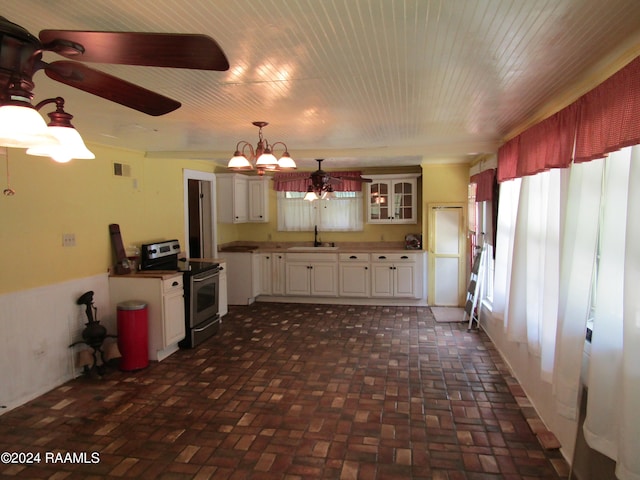 kitchen featuring stainless steel range with electric stovetop, sink, decorative light fixtures, white cabinets, and a chandelier