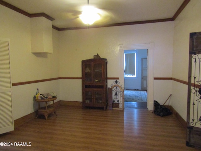 interior space featuring dark hardwood / wood-style floors and ornamental molding