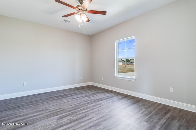 spare room featuring ceiling fan and dark hardwood / wood-style floors