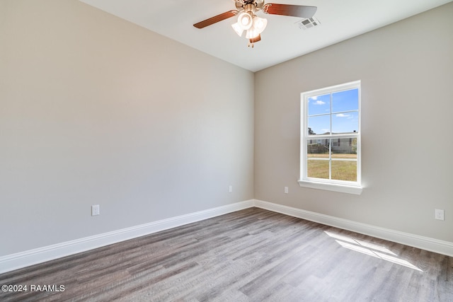 empty room featuring ceiling fan and hardwood / wood-style flooring