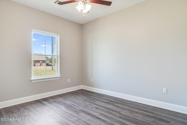 spare room with ceiling fan and dark wood-type flooring