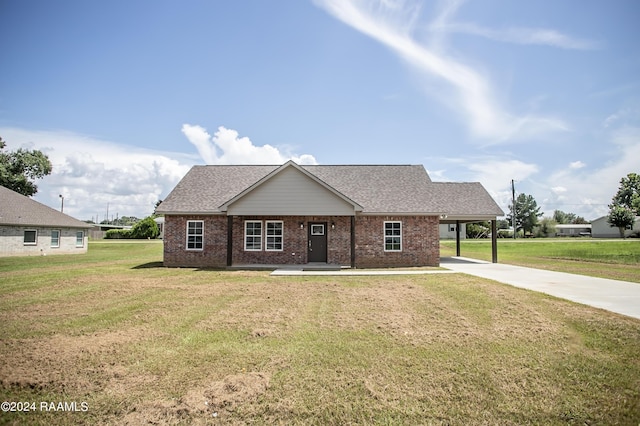 view of front facade with a front lawn and a carport