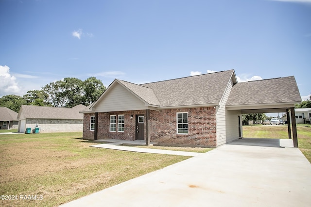 view of front of home with a front lawn and a carport