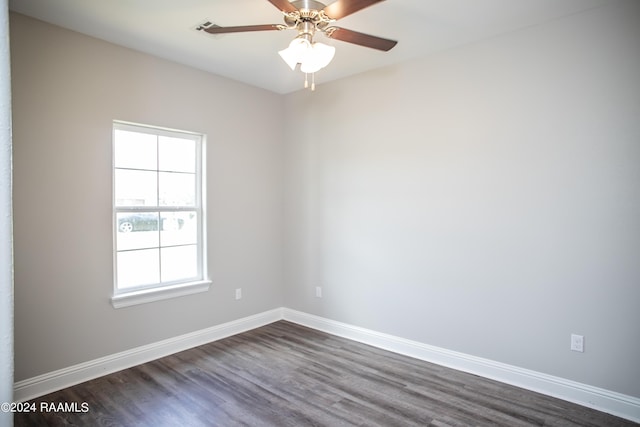 spare room with ceiling fan and dark hardwood / wood-style floors