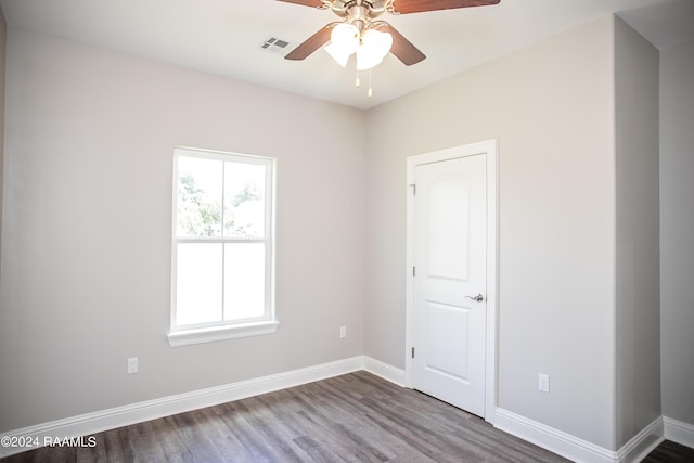 empty room featuring ceiling fan and hardwood / wood-style floors